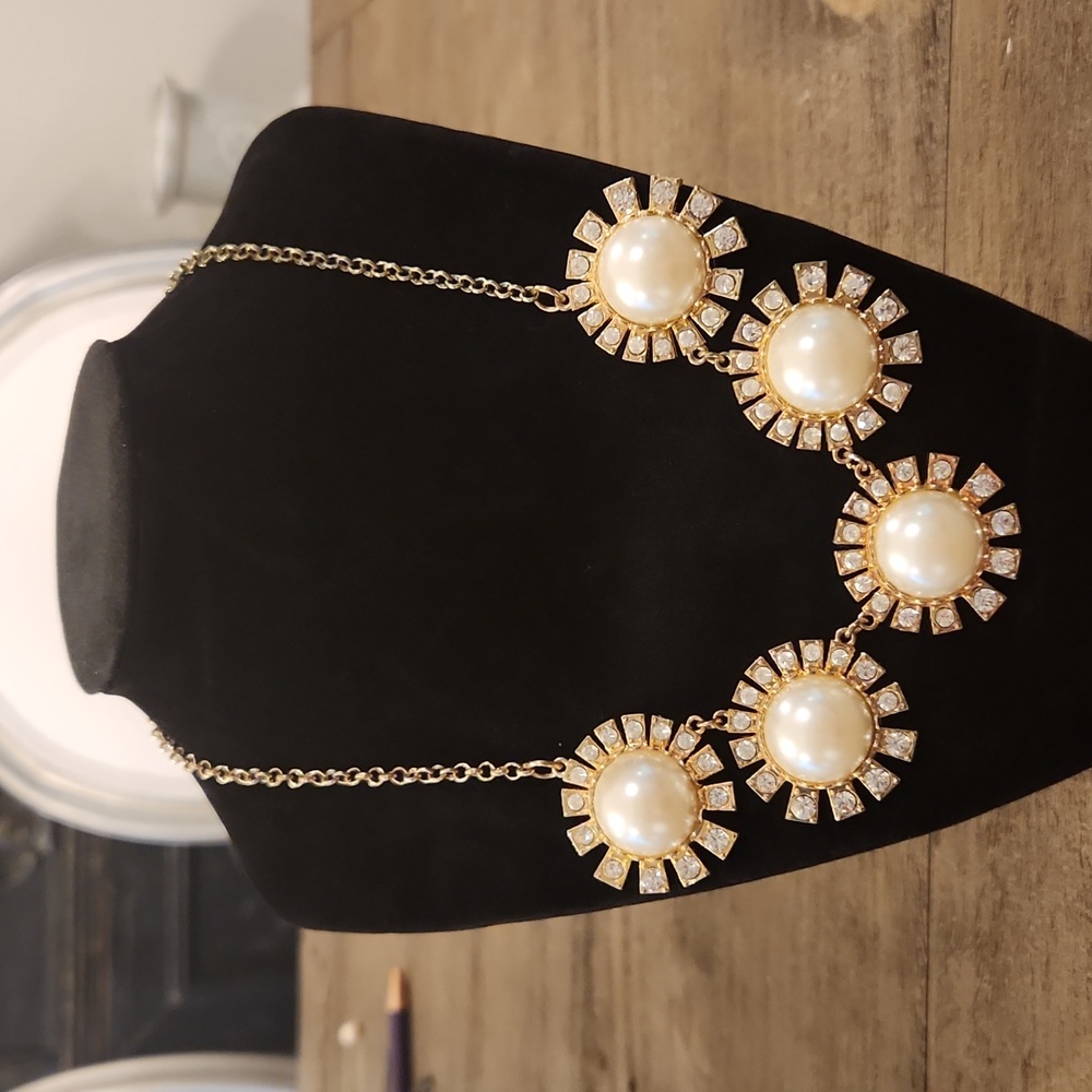 Gold tone necklace with pearls and crystals.